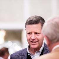 David Hooker talking with guests.